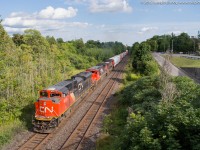 <b>Going Wide At Paris Road</b> <br><br>CN 435 is seen departing Brantford with CN 8839 manning the point on a sunny August afternoon. 