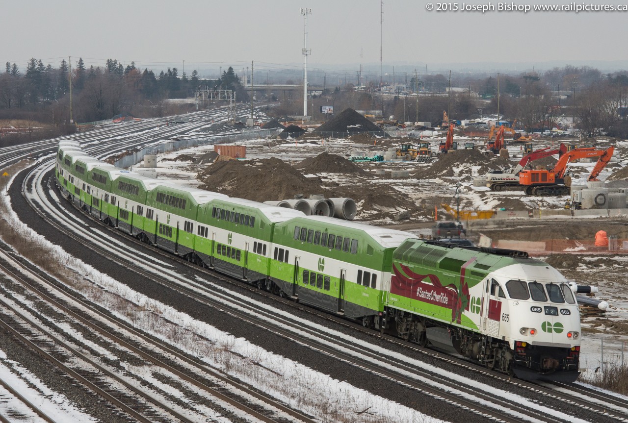 GOT 665 leads "Santas Other Ride" past Hopkins in a scene that is forever changing as a new GO Transit facility is being constructed there and the bridge will be taken down in the near future.