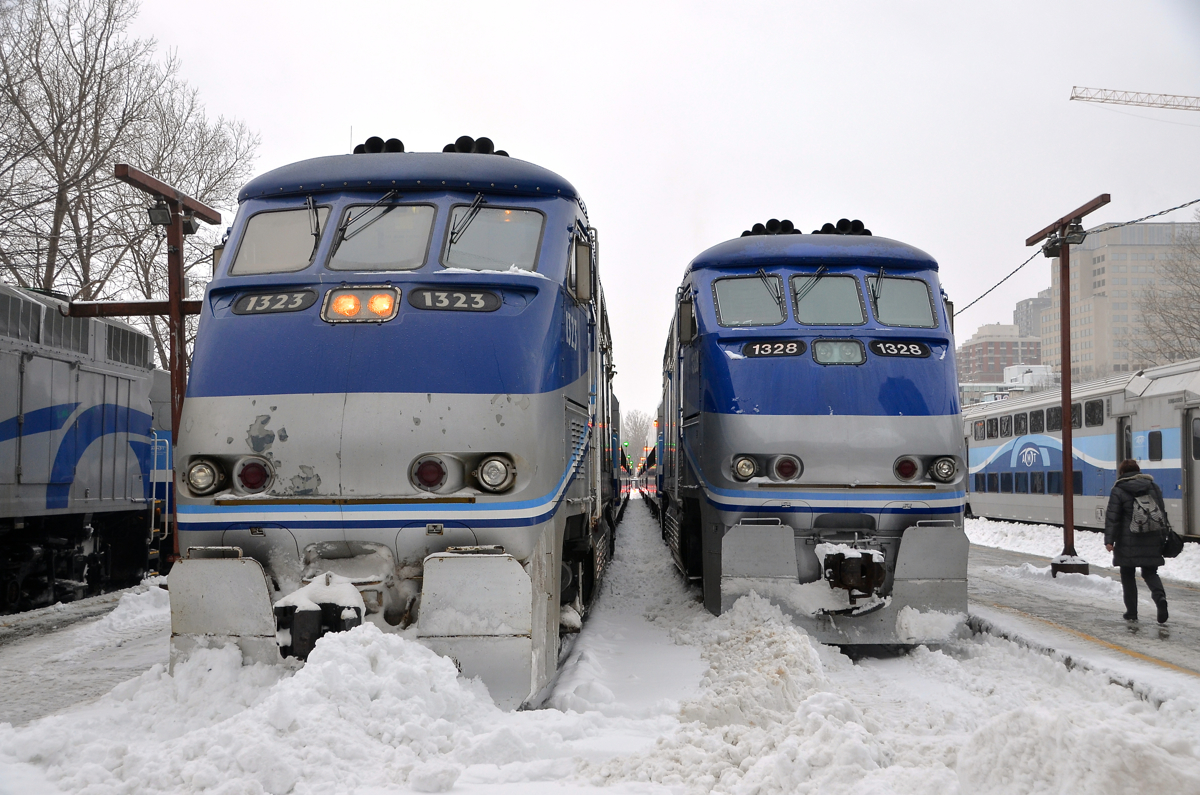 A pair of F59PHI's in the snow. A pair of AMT F59PHI's (AMT 1323 & AMT 1328) are spotted in the snow at Lucien L'Allier Station in Montreal, both leading Candiac-line trains.