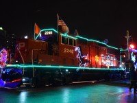 The Canadian Pacific Holiday train is stopped at St. George Street in London, ON. This years power is 2246 (a GP20c-ECO). The previous rain provided a nice reflection of the lights on the road. 