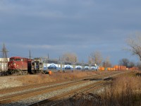 <b>Out for the inspection.</b> The crew of CP 143 (with CP 9770 leading) is out to inspect AMT 53 which is heading west through Dorval led by cab car AMT 3015. As soon as AMT 53 passes CP 143 will follow it westwards.