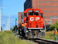 <b>After throwing the switch.</b> CP 3048 is heading back to its train on the Lasalle Loop after switching out Fleischmann's Yeast.
