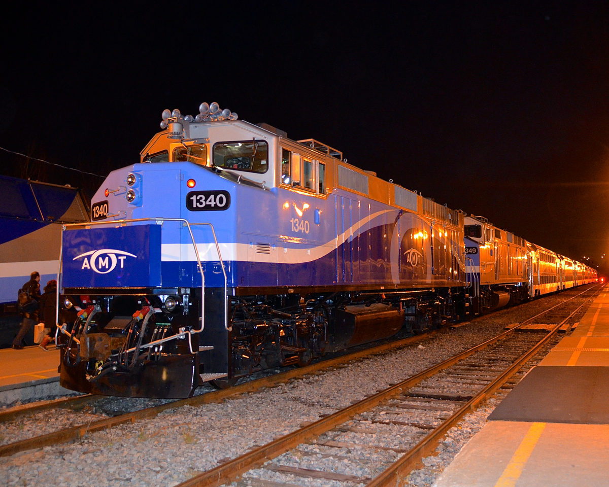 First day in service. AMT 1340 is in service for the first day after being repainted and refurbished as it heads AMT 25 at Lucien L'Allier Station in downtown Montreal. Behind it is a slightly older repaint, AMT 1349. These two units will stay together in service for a little while, until the AMT is sure there are no problems with AMT 1340.