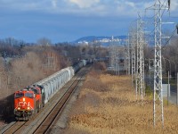 <b>Elephant style gevo's.</b> CN 377 rounds a curve in Pointe-Claire with a pair of ES44AC's elephant style for power (CN 2905 & CN 2898).