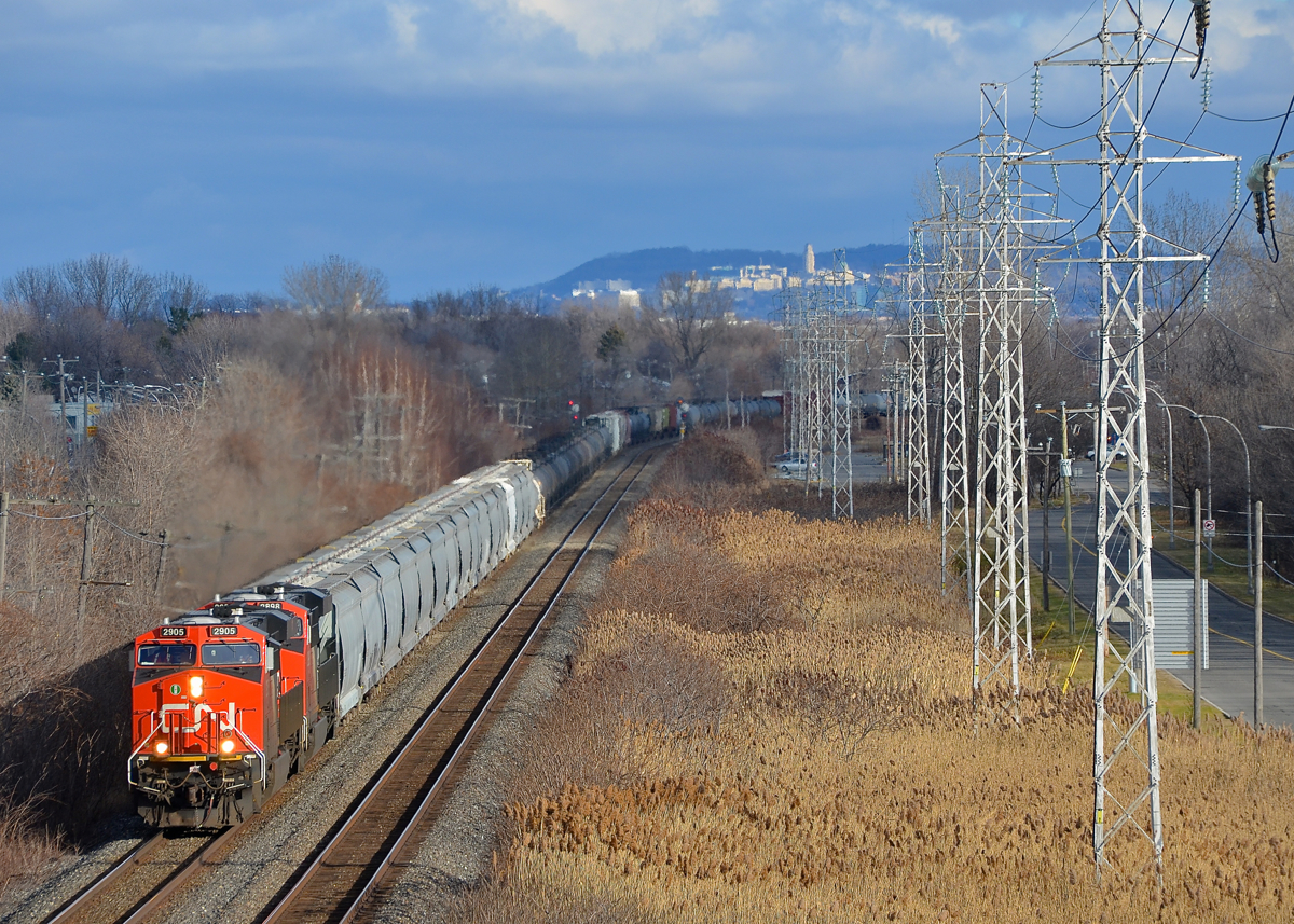 Elephant style gevo's. CN 377 rounds a curve in Pointe-Claire with a pair of ES44AC's elephant style for power (CN 2905 & CN 2898).