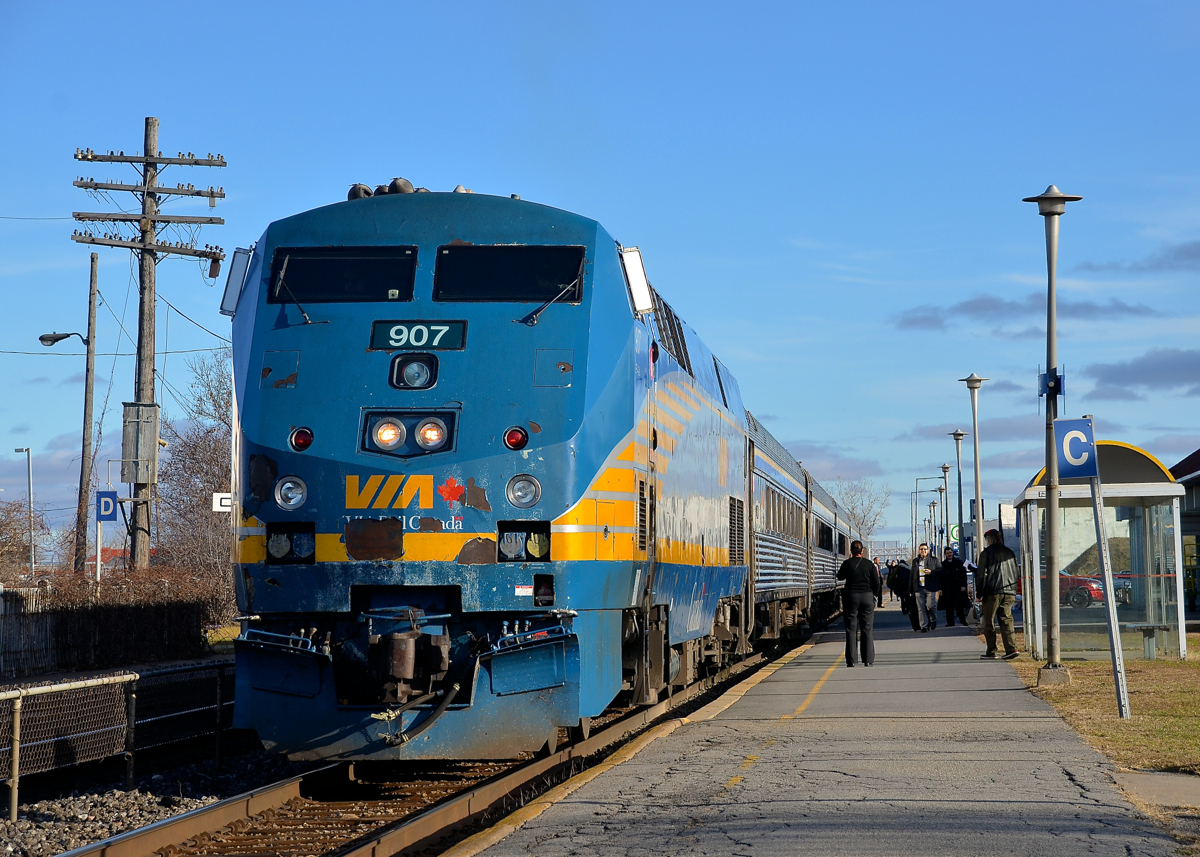 A beat up nose. The nose of VIA 907 has seen better days as it leads VIA 55 which is stopped to board passengers at Dorval Station.