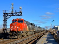<b>Gotta love winter light.</b> A long CN 377 is storming through Dorval with CN 2942 leading and CN 3003 mid-train. While the days are very short this time of year, the winter light is hard to beat.