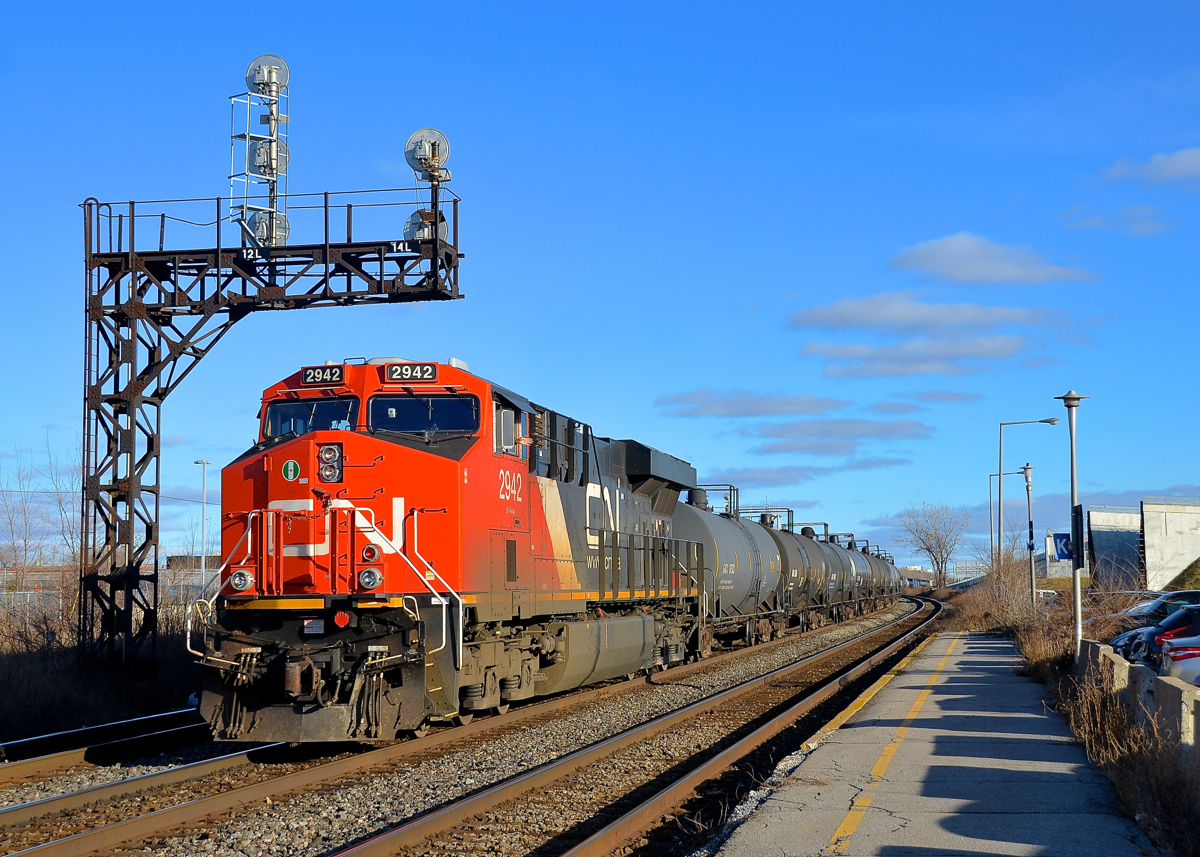 Gotta love winter light. A long CN 377 is storming through Dorval with CN 2942 leading and CN 3003 mid-train. While the days are very short this time of year, the winter light is hard to beat.