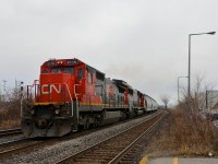 While through freights on CN's Montreal-Toronto corridor are mostly the domain of boring ES44AC's these days, once in awhile a stellar lashup appears. Witness CN 377 with 15th anniversary unit CN 2115 & ex-Oakway CN 5405 heading west through Dorval on a grey afternoon.