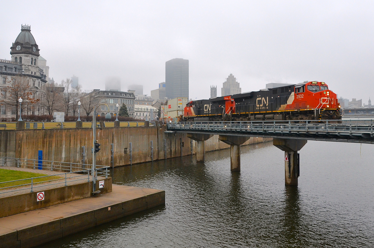 A foggy morning. CN 149 is crossing the Lachine Canal in Montreal with a pair of ES44AC's (CN 2932 & CN 2930) on a very foggy morning.