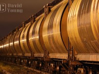 Lambs to the slaughter.... A string of aluminum CNWX hoppers sit in at Thunder Bay North awaiting the scrappers torch on a rainy, October evening in CN's Port Arthur yard.