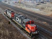 Perhaps the closest to an original Geep on CN today:  CN 7046 – CN 4116.
<br>
<br>
Both were  GP9's with 567 engines, and are now model GP9RM  with 16-645 engines. 
<br>
<br>
CN 7046 was rebuilt 1992 by Atelier ( Montreal) from 4282 ( GMD 1959 )
<br>
<br>
CN 4116 was rebuilt 1984 by CN Point St. Charles shop from CN 4131 ( GMD 1957)
<br>
<br>
 CN 7046 – CN 4116  ( CN 546?)  prior to pushing 11 loads from  Gerdau Ameristeel.
<br>
<br>
Mile 304 Kingston Subdivision, Hopkins Street overpass, Whitby, Ontario, December 9, 2015 image by S.Danko.
<br>
<br>
The Geep:
 <br>
<br>
        <a href="http://www.railpictures.ca/?attachment_id=22043"> at Leaside </a> 
 <br>
<br>
What's interesting:
<br>
<br>
Note the Marker Lights on both 7046 and 4116
<br>
<br>
In the background: Construction of the new GO service facilities.
<br>
<br>
sdfourty
