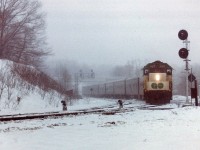 An all-day miserable snowstorm, much more frequent then than now; sets the scene for this image taken from the former railfan parking area at Bayview Junction. Perhaps this inclement weather is the reason GO 507, (GP40TC) is subbing for the usual CN tempo engine this time around. There are the standard 8 cars in tow. The 507, originally 607 when it joined on with GO Transit in 1966, went to Amtrak in 1988 as their 199.