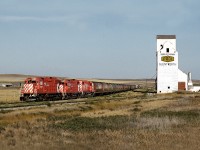 CP's Assiniboia Tramp grain spotter, westbound on the line to Mankota, pulls up to the elevator at Glentworth to spot empties. The line was abandoned the following year.