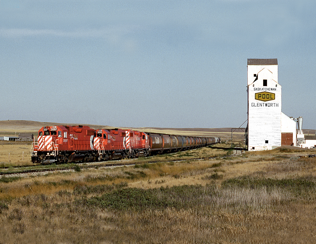 CP's Assiniboia Tramp grain spotter, westbound on the line to Mankota, pulls up to the elevator at Glentworth to spot empties. The line was abandoned the following year.