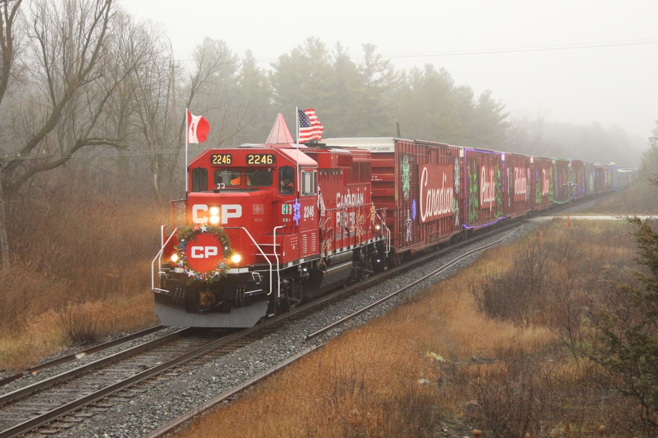 CP 2246 leads this years holiday train, in what can only be described as crappy weather with fog and rain,  past SR 20 on the Galt sub on its way to the Cambridge show at 5pm