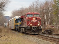 CP 8763 leads ICE 6212 (City of Buffalo) around the bend and up to the Martin Street crossing in Milton with a mixed manifest of freight and autoracks.