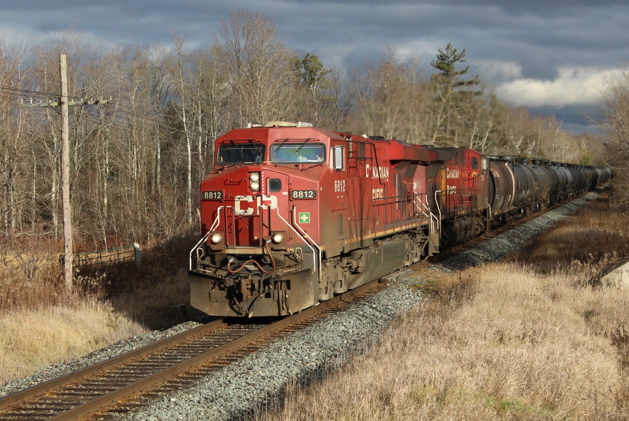 With rain all around, mother nature was kind to me this time. The clouds parted just as CP 8812 with CP 9759 worked their way up the grade at MM43 on the Galt sub.
