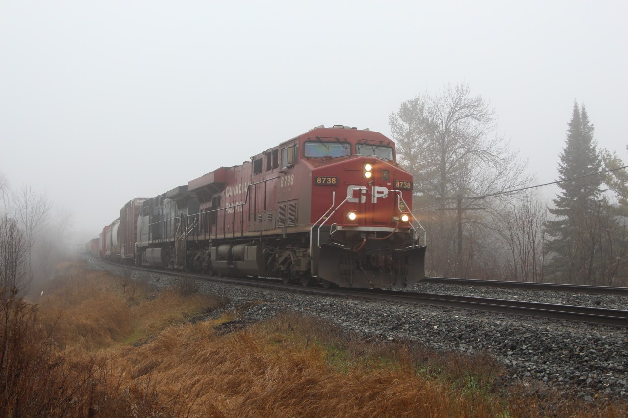 After its trip up from Hamilton, CP 8738 leads CEFX 1033 through the fog and up to Tremaine Road just outside Milton on what would prove to be a record warm day here.