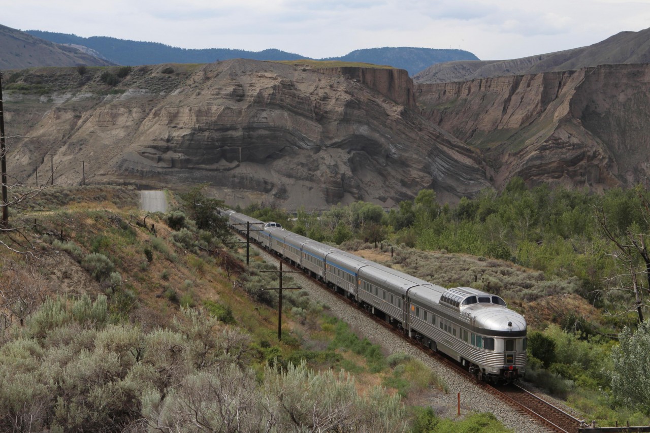 VIA's Canadian was not too much in a hurry on June 25, 2015, despite being about 12 hours late. A short sprint afforded a going away shot just east of Ashcroft. I especially like the faults in the walls of the surrounding hills.