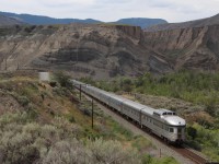 VIA's Canadian was not too much in a hurry on June 25, 2015, despite being about 12 hours late. A short sprint afforded a going away shot just east of Ashcroft. I especially like the faults in the walls of the surrounding hills. 
