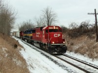 On the last day of the year, CP sent an ex-SOO sandwich. Leading is CP 6255 (GMD SD60) followed by DME 6090 (City of Phillip) and CP 6262 (GMD SD60M) on their way to Guelph Junction approaching MM43 on the Galt sub. 
The CTG says ex-SOO 6262 is a one of a kind. Sure would have been nice to see this leading.