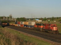 CP 255 with CP 5997 and BNSF 6919 repaying some HP hours...heads east on the CN just after sunrise.  Shot from the berm...in the days I could drive my car up to this spot. I notice some industrious railfans have now planted "lounger" chairs here :)