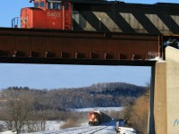 A bitter cold Saturday morning in February 2008....a late running train 149 WB with a long gone SD50 5403 leading heads over the CP as eastbound 240 descends down from Guelph Jct. 