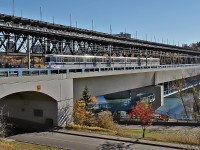 Edmonton Transit car #1019, a 1982 built Siemens-Duewag U2 light rail vehicle crosses the Dudley B. Menzies Bridge on the North Saskatchewan River.