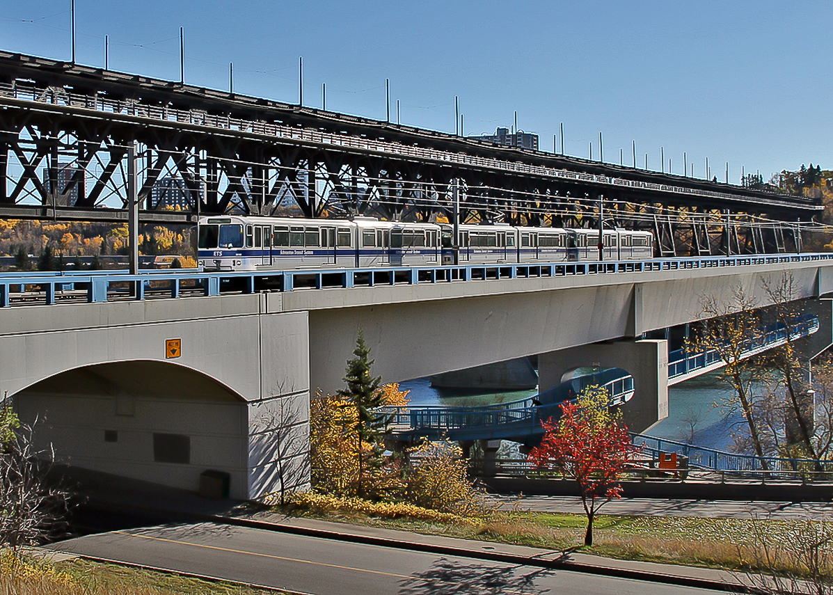 Edmonton Transit car #1019, a 1982 built Siemens-Duewag U2 light rail vehicle crosses the Dudley B. Menzies Bridge on the North Saskatchewan River.