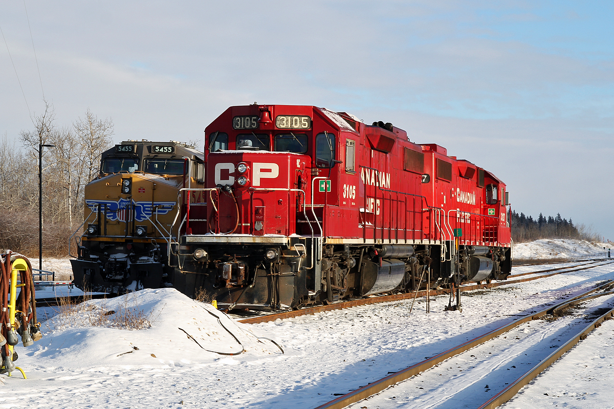 Sitting in CP's Scotford Yard are SD38-2's CP 3105 and 3127.  Behind is ES44AC UP 5455.