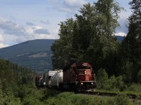 One of the surprises of my visit to Canada in 2015 was a weed train on the Kootenay Valley Railway. The train had come to Cranbrook, Bc behind a toasted AC4400. There 9672 was replaced by SD40-2 5560, one of three units remaining in the StL&H paint scheme. Just west of Curzon, BC the weed train is seen climbing out of the valley of the Moyie River on its way to Creston, BC.