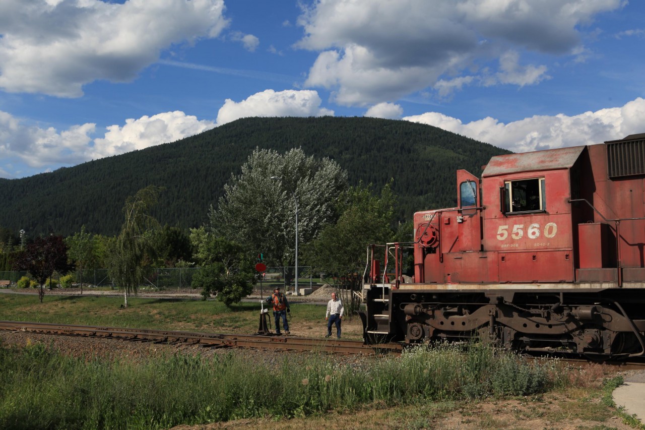 A timeless scene with a local looking on. The weed train is being put away for the night in Curzon, BC.