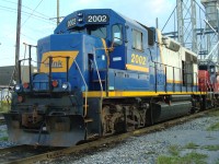 A former Helm Leasing GP38 passes through Toronto along with a GEXR unit.