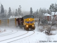 With a splash of yellow and red on an otherwise grey day, UP 3643 east is finally on the move after a hotbox setoff at Guelph Junction.