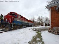 <b>Have a seat in the chair,</b> the last train of 2015 is about to pass. The years work completed, 580 is wyeing prior to heading back to Kitchener light power to  enjoy new years eve festivities. Happy New Year from all of us (and myself) to our regular viewers and contributors.<br><br>I still say this would have been a neat spot to watch trains 45 years ago.. unit oil trains one way per day (to Douglas Point via the Guelph, Fergus, Owen Sound, Kinkardine subs).. caboose hops from the station for locals, daily CN commuter trains (with heavyweights!) also wyed here until 1975, local wayfreights carrying livestock for the rural stations to the north, and plow extras all winter long. If only that house, or the residents of such, could tell us a few stories.