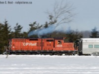 <b>Getting the hell out of dodge</b>.. err.. Brampton.. 8249 blasts a puff of white smoke as Engineer Wayne Thompson accelerates her to track speed, its EMD 567 groaning a melodic tune. The next town up the line is Boston Mills, the now famous name of a company that publishes some great books for the likes of us. Notably this was the very last GP9 to survive on CP before being retired.