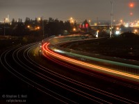 There's a certain allure to quiet, easily accessible locations that provide us photographers opportunities for study of our craft, and Hopkins St is one of these places. Shootable from north and south sides, from sunrise to sunsets.. this location has it all, and even provides an opportunity for night photography that I could not resist. 

I made the trip to Ottawa and Back on the 10th to visit with a friend, having been up since 0445 I was quite tired, 9 PM by the time I arrived at Hopkins St on my westward journey. I got the tripod out and see what I could do , and this was my best result. One friend of mine who saw this shot commented that he grew out of this phase of photography - truth is I never did much night photography until fairly recently, so I guess I haven't grown out of it yet!. I enjoyed taking this photo very much.<br><br>
But why have there been so many photos from this location lately?<b>This overpass is closing, permanently, and being demolished</b> scheduled to be closed this spring as soon as the road seen in the distance by the shoo-fly is completed. Get out there while you can.. there aren't many places like this.<br><br>