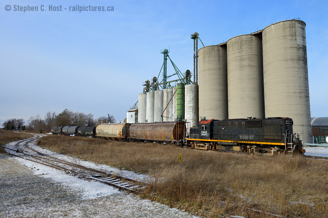 It's been two years since Trillium abandoned the Cayuga spur and in this scene the crew has gone for coffee while the train idles before continuing to Tillsonburg. For a brief, and very brief moment, the sun came out and I was able to capture this scene. Who knows how long it will be until this line is active again? Cross your fingers, in the last few months this line went from 'likely to be abandoned' to 'likely to be saved' once again.

Peel the time machine back a further 20-30 plus years, this was NS/N&W/Wabash territory with up to four mainline freights each way.. powered by London built FP7's..