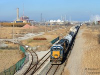 <b>In the heart of the Chemical Valley</b> a CSX operation, isolated from the rest of the CSX network continues to toil 7 days a week in Sarnia, Ontario. With a history that goes back to the Chesapeake and Ohio Railway, the conductor on this train living proof of it, having joined the C&O's Canadian Division in 1967 and continues employment to this very day. The crew has just returned from the CN, and are shoving their train of 38 cars to the rear into the CSX Sarnia yard.