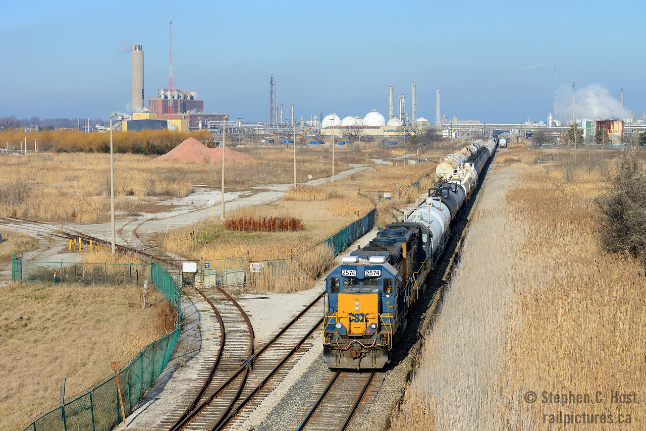 In the heart of the Chemical Valley a CSX operation, isolated from the rest of the CSX network continues to toil 7 days a week in Sarnia, Ontario. With a history that goes back to the Chesapeake and Ohio Railway, the conductor on this train living proof of it, having joined the C&O's Canadian Division in 1967 and continues employment to this very day. The crew has just returned from the CN, and are shoving their train of 38 cars to the rear into the CSX Sarnia yard.