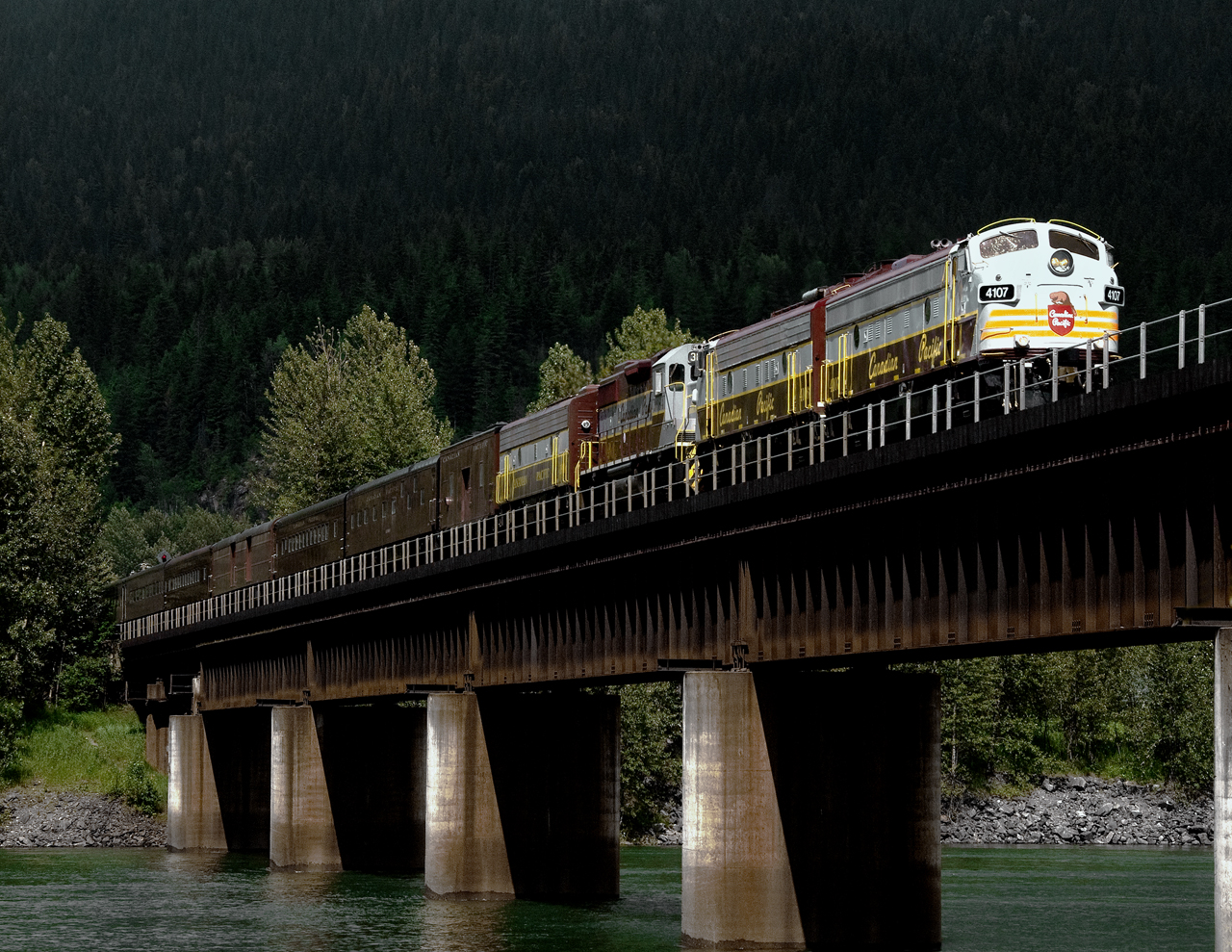 F unit 4107 leads a Vancouver bound CP special across the Columbia River at Revelstoke BC