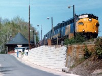 It was a tad disappointing that due to sun angles and other such aggravations, shooting the Toronto portion of the old Canadian southbound at Parry Sound was a bit of a challenge.  That is, if you were tired of seeing it rolling over the harbour trestle. Rather than being along the platform and shooting it head-on, I elected to go down on the street and try the scene from there. Not bad, but I could not avoid the sun reflection on the windshield. A bit of servicing and a lot of social chatter, and the train was soon off again. VIA 6306 and 6635 the power on a beautiful spring day. VIA 6306 was the former 6520; it ended up in tourist service in Quebec in 1994, went to Waterloo & St. Jacobs in 1997 as their 6508, and now in new spiffy paint working at the OSR !!! What a life. And what a gem.