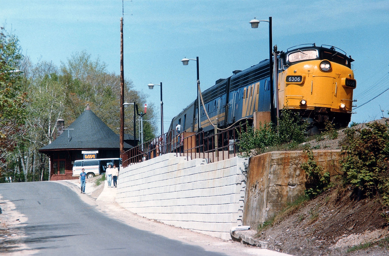 It was a tad disappointing that due to sun angles and other such aggravations, shooting the Toronto portion of the old Canadian southbound at Parry Sound was a bit of a challenge.  That is, if you were tired of seeing it rolling over the harbour trestle. Rather than being along the platform and shooting it head-on, I elected to go down on the street and try the scene from there. Not bad, but I could not avoid the sun reflection on the windshield. A bit of servicing and a lot of social chatter, and the train was soon off again. VIA 6306 and 6635 the power on a beautiful spring day. VIA 6306 was the former 6520; it ended up in tourist service in Quebec in 1994, went to Waterloo & St. Jacobs in 1997 as their 6508, and now in new spiffy paint working at the OSR !!! What a life. And what a gem.