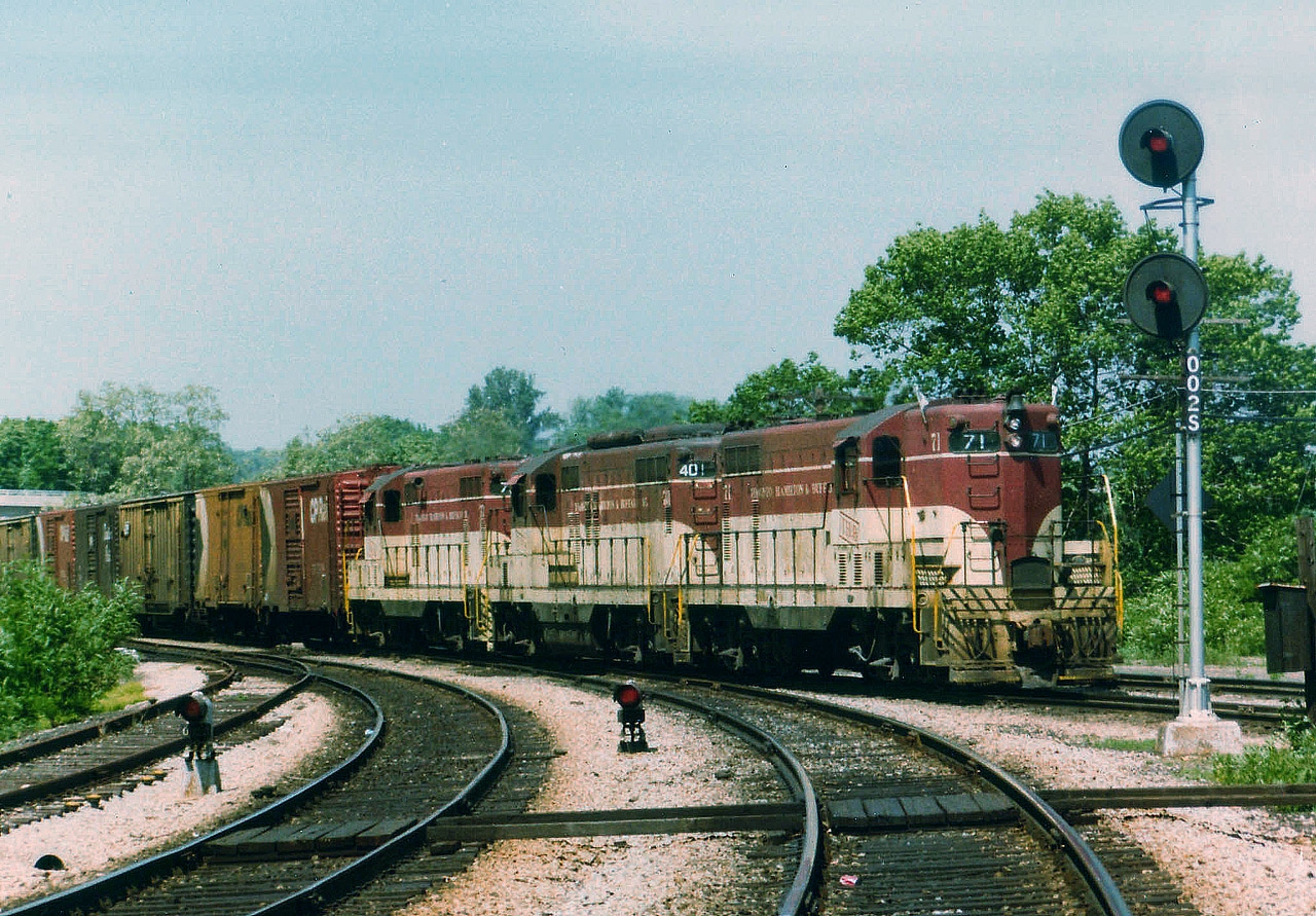 Hamilton-bound TH&B Starlite; with the 'legendary' #71 leading 401 and 77, passes the Dundas Sub connection at Bayview Junction on a much earlier than usual afternoon run. No. 71, a GP 7, demolished in a collision with a truck at a level crossing in Welland, ON back on Feb 12, 1980; was the first diesel unit ever to be wholly manufactured in Canada.