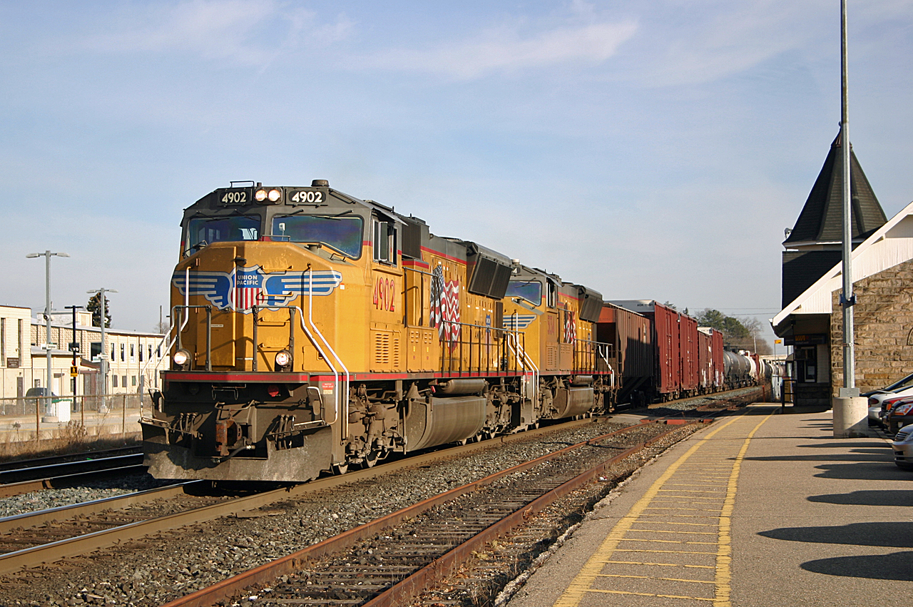 CN 393 highballs past the station at Georgetown with a pair of UP SD70Ms,4910 and 5134.