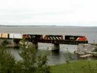 CN's St.Felicien switcher returning home to Chambord Que. crosses the Ouachitan River at its juncture with Lac Ste. Jean