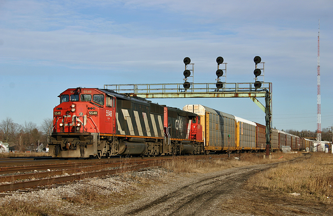 Oshawa to Chicago train 271 rolls under the classic signal bridge at Paris Junction with CN 5548 and CN 5351 providing the power.