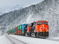 CN's new ET44AC units are finally starting to make it out west on a somewhat regular basis. Here, CN 3008 leads the mighty Q111 through a snowy scene, west of Geikie on CN's Albreda Sub.