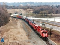 I found myself going into some sort of "railfanner's heat" when this train entered my viewfinder as I stood looking over the High Level bridge at the west end of Hamilton. There had been some interesting lashups as of late but this one was a real treat. CP 5733, 5475, 4237, 4243, 4226, 4718, 4241 and 1621 are seen slowly making their way along. (Hwy 403 is in the background). Certainly a lot of history in these units: 5733 ret'd 2008; 5475 (converted to a "B") went to NRE 2004; 4237 to Delson RR Museum; 4243 to NBEC; 4226 converted to control cab 1104; 4718 "re-retired 1995; 4241 to Que Gatineau; and 1621 was retired in 2011. Note construction for extra track to accommodate GO Transit service for Hamilton is just underway.